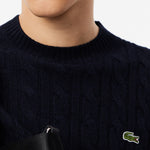 Maglione girocollo a trecce in lana cardata 