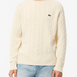 Maglione girocollo a trecce in lana cardata 