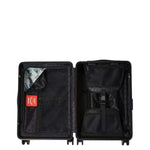 center rip revealing gray check carry-on luggage