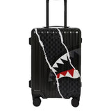 center rip revealing gray check carry-on luggage